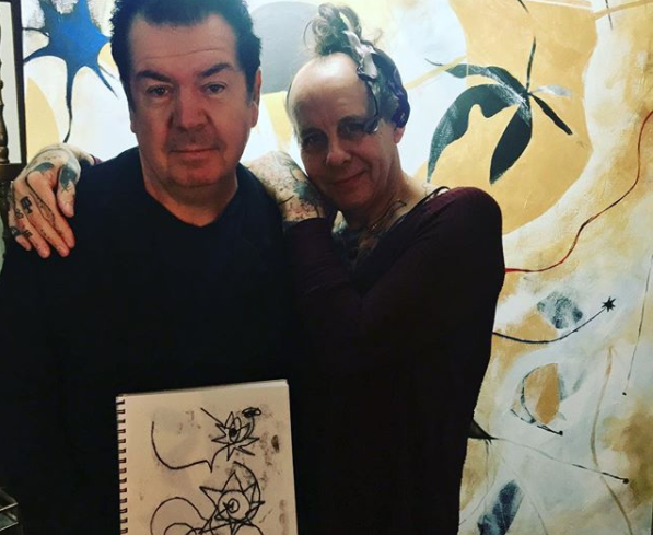 Lol Tolhurst with Pearl Thompson and his original artwork