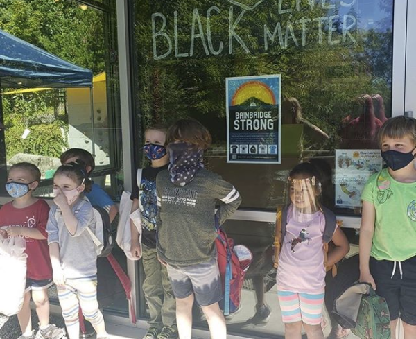 Bainbridge Strong poster in KiDiMu front window