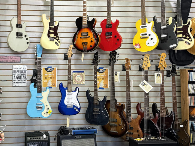 Electric and bass guitars with amps at Rockin' Ruby's Poulsbo store